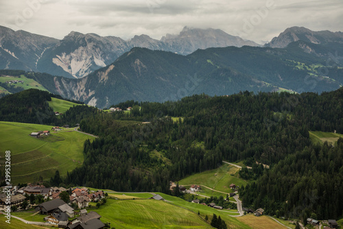 Dolomites, Italy - July, 2019: Small houses and big dolomite mountains valley.