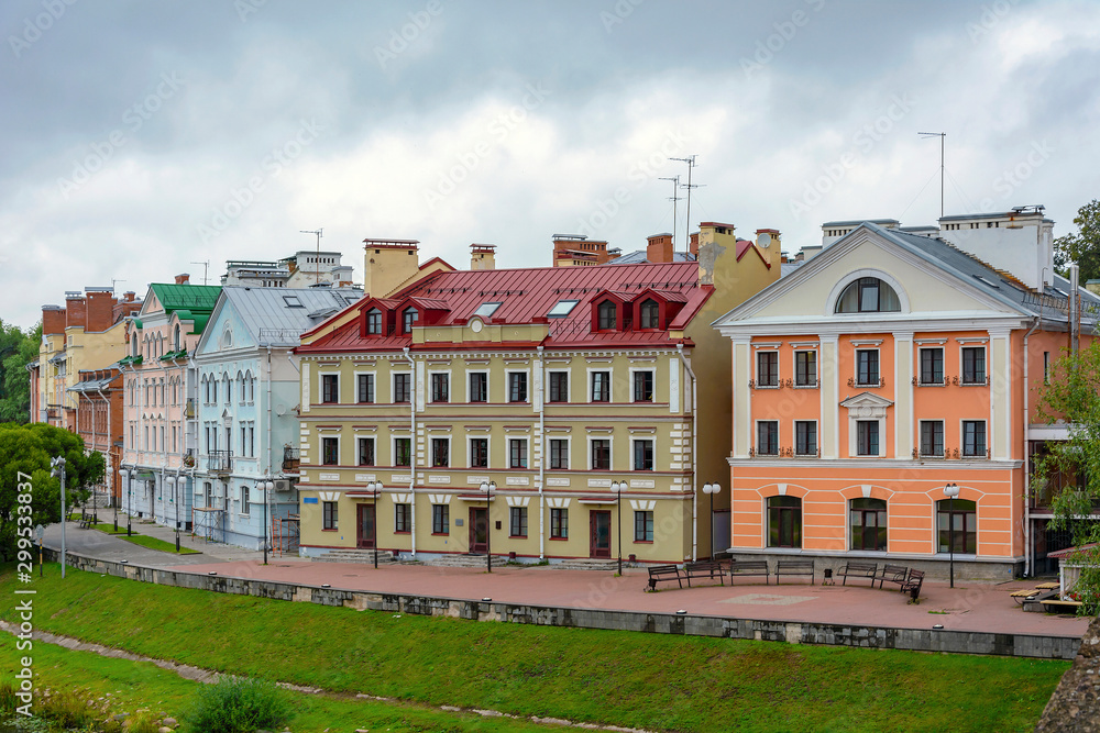 Pskov, old colorful buildings on the Golden embankment of the Pskova river