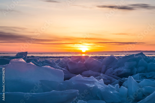 Sunrise over the ice of lake Baikal in winter, Eastern Siberia, Russia © vesta48