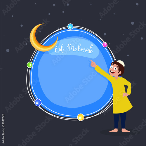Happy muslim kid pointing towards moon, Blessed fetival Eid mubarak concept.