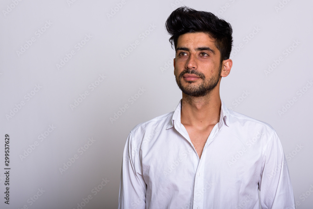 Portrait of young handsome bearded Persian businessman Portrait of young handsome bearded Persian businessman