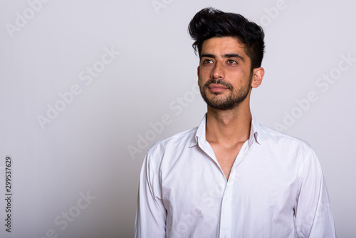 Portrait of young handsome bearded Persian businessman © Ranta Images