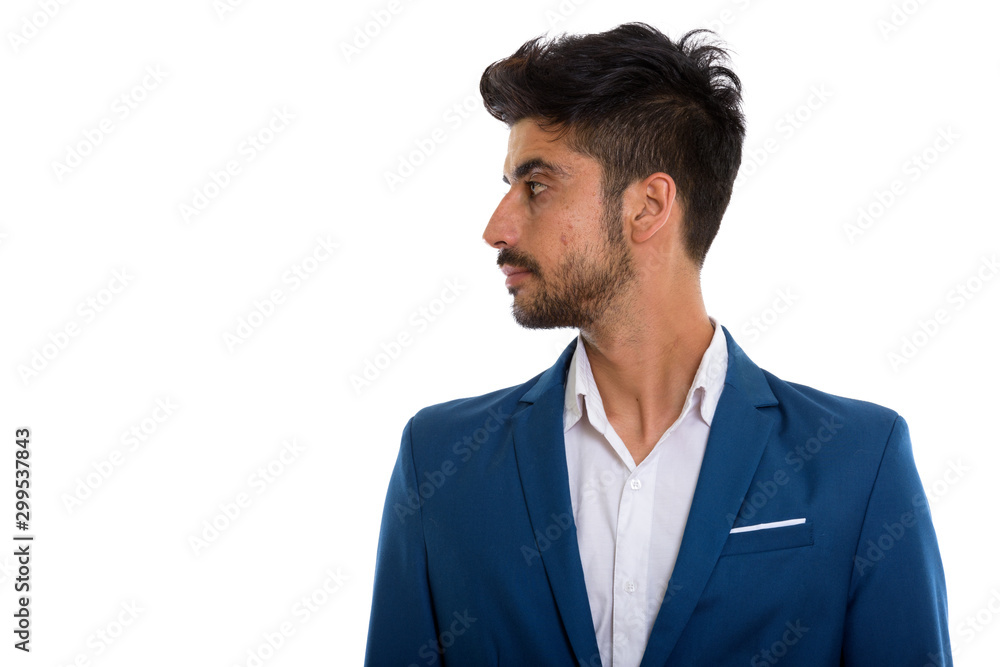Young handsome bearded Persian businessman in suit