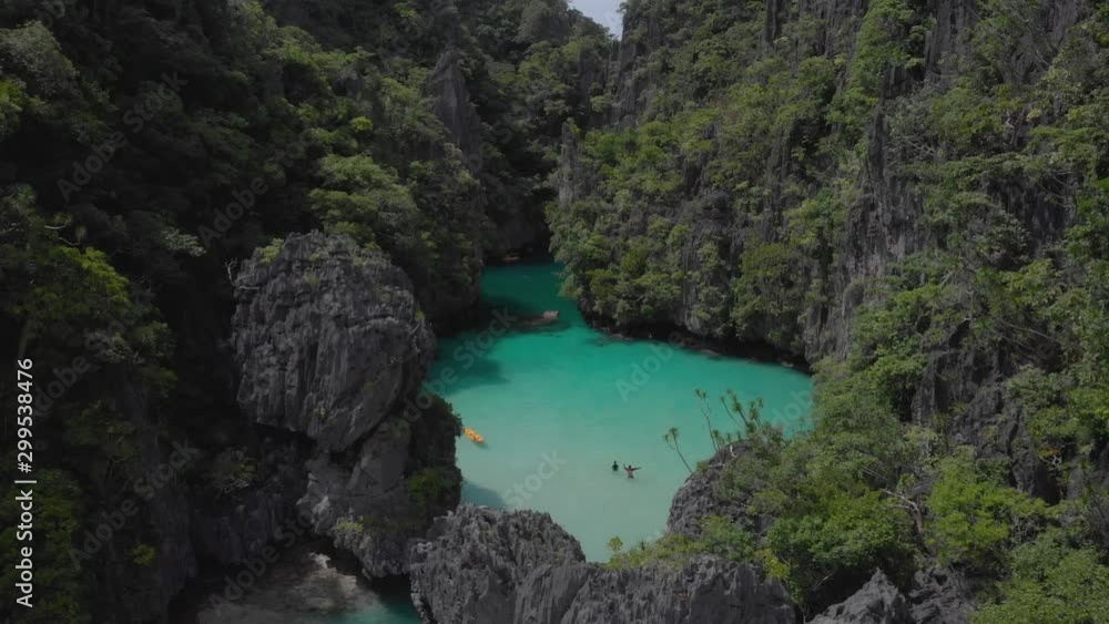 Epic limestone mountains and clear waters of El Nido, Philippines, aerial shot at Small Lagoon in Palawan Epic limestone mountains and clear waters of El Nido, Philippines, aerial shot at Small Lagoon in Palawan