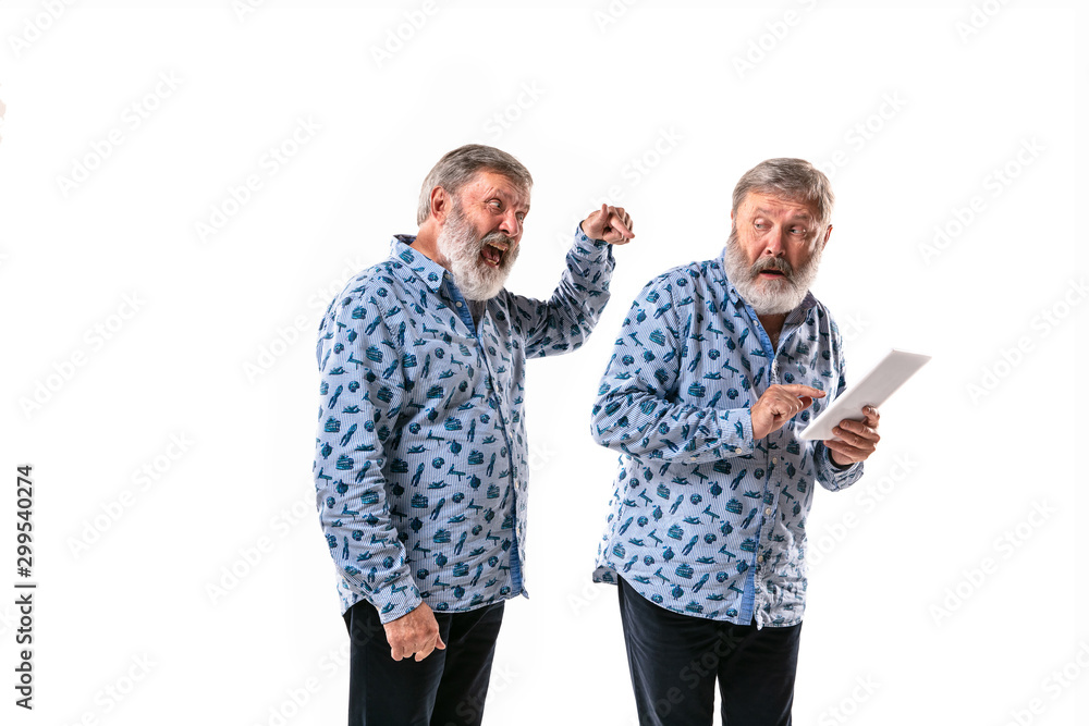 Senior man arguing with himself on white studio background. Concept of human emotions, expression, mental issues, internal conflict, split personality. Half-length portrait. Negative space. Scaring. Senior man arguing with himself on white studio background. Concept of human emotions, expression, mental issues, internal conflict, split personality. Half-length portrait. Negative space. Scaring.