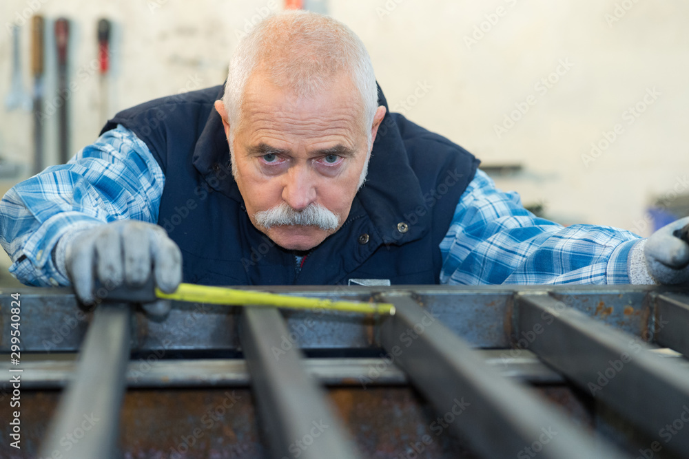 senior man working in his workshop senior man working in his workshop