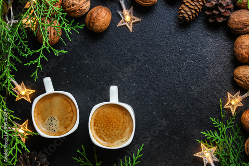 coffee, New Year, Christmas background or Noel holiday festive (nuts, specials, decorations and gifts on the table, greeting card) menu concept. food background. copy space. Top view