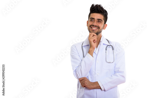 Portrait of young handsome bearded Persian man doctor