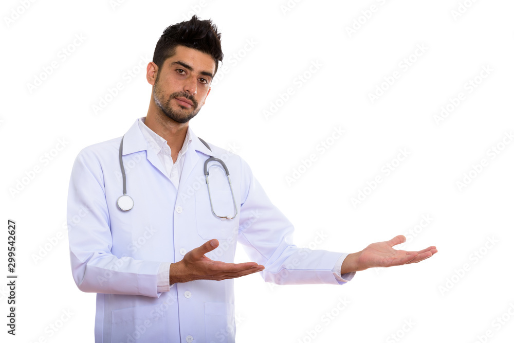 Portrait of young handsome bearded Persian man doctor Portrait of young handsome bearded Persian man doctor
