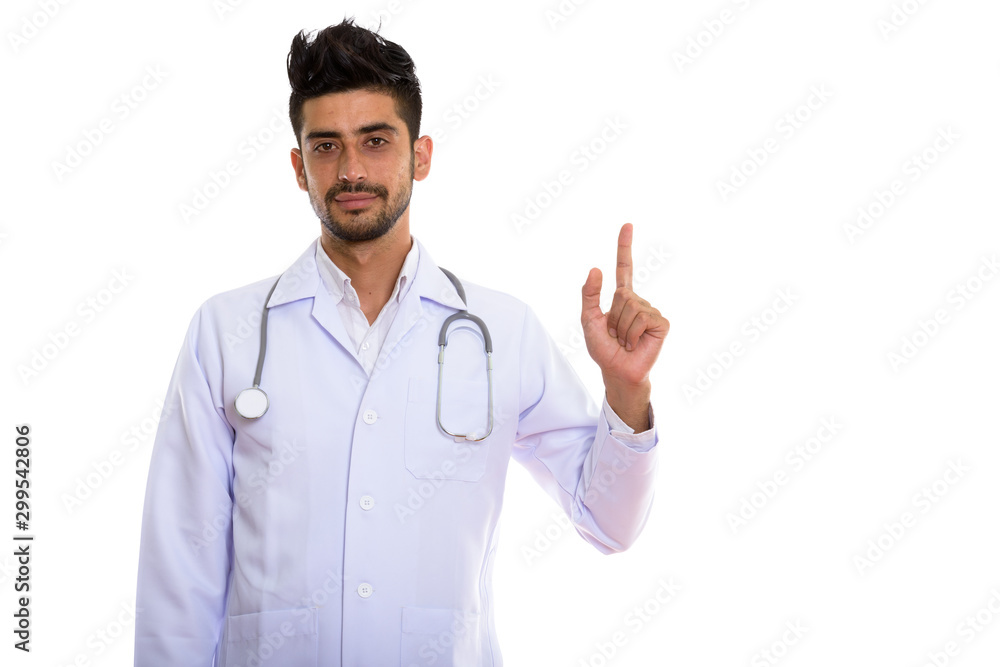 Portrait of young handsome bearded Persian man doctor Portrait of young handsome bearded Persian man doctor