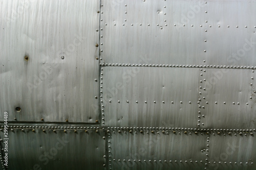 Aluminum sheet and rivet fastening. Aviation background.