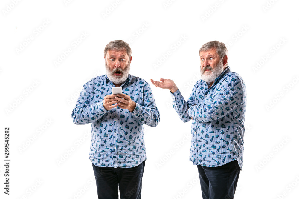 Senior man arguing with himself on white studio background. Concept of human emotions, expression, mental issues, internal conflict, split personality. Half-length portrait. Negative space. Shocked. Senior man arguing with himself on white studio background. Concept of human emotions, expression, mental issues, internal conflict, split personality. Half-length portrait. Negative space. Shocked.