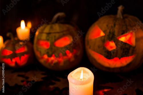 burning candles on black halloween background