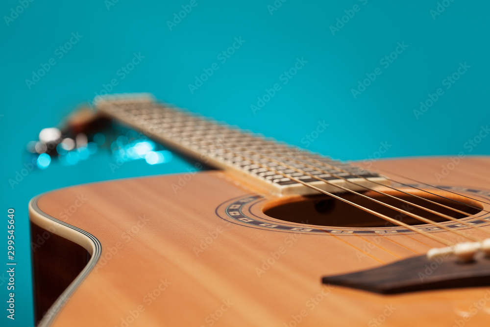 Fototapeta premium Acoustic guitar with blue light