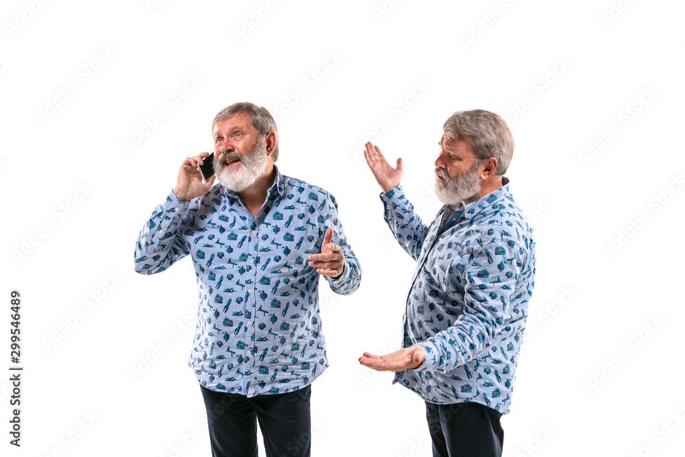 Senior man arguing with himself on white studio background. Concept of human emotions, expression, mental issues, internal conflict, split personality. Half-length portrait. Negative space. Inviting. Senior man arguing with himself on white studio background. Concept of human emotions, expression, mental issues, internal conflict, split personality. Half-length portrait. Negative space. Inviting.