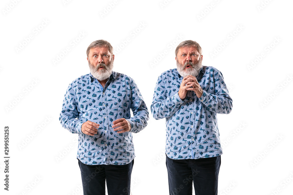 Senior man arguing with himself on white studio background. Concept of human emotions, expression, mental issues, internal conflict, split personality. Half-length portrait. Negative space. Scared. Senior man arguing with himself on white studio background. Concept of human emotions, expression, mental issues, internal conflict, split personality. Half-length portrait. Negative space. Scared.