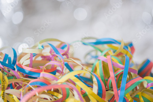 Streamers background. Simple beautiful shining background..Wooden table with paper streamers for the funny party.