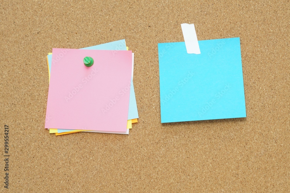 Sticky and pin blank paper notes on cork board to remind. Sticky and pin blank paper notes on cork board to remind.