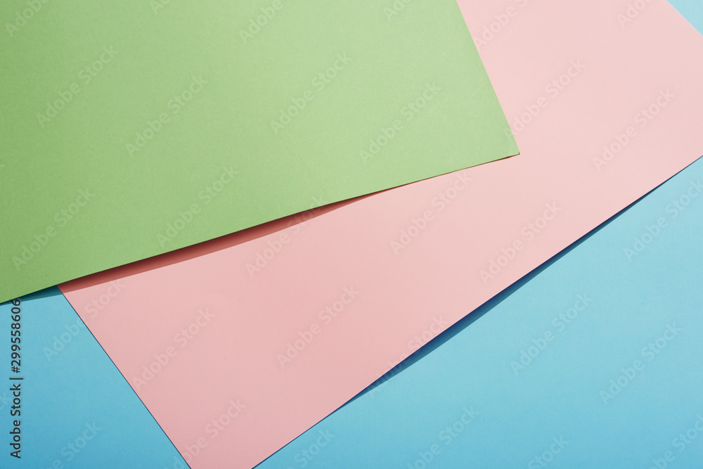 Color papers geometry flat composition background with green pink and blue tones Color papers geometry flat composition background with green pink and blue tones