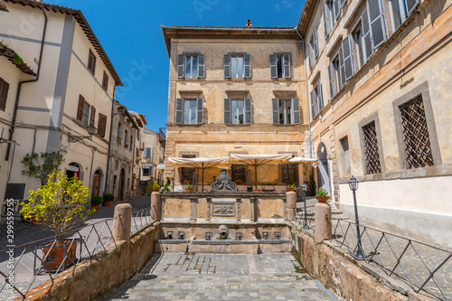 Historic fountain on San Rocco square in Bolsena, Italy.