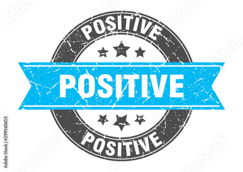 positive round stamp with turquoise ribbon. positive
