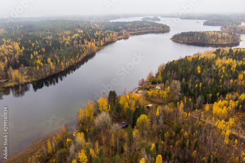 Aerial view of lake and colorful forests on a autumn day in Finland. Drone photography
