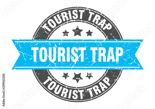 tourist trap round stamp with turquoise ribbon. tourist trap