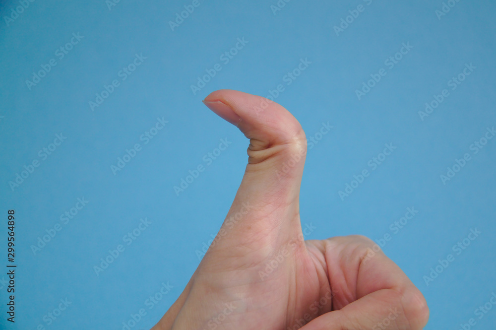 Over flexible thumb on blue background Over flexible thumb on blue background
