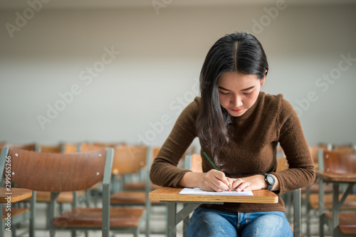 Female students taking tests at the university