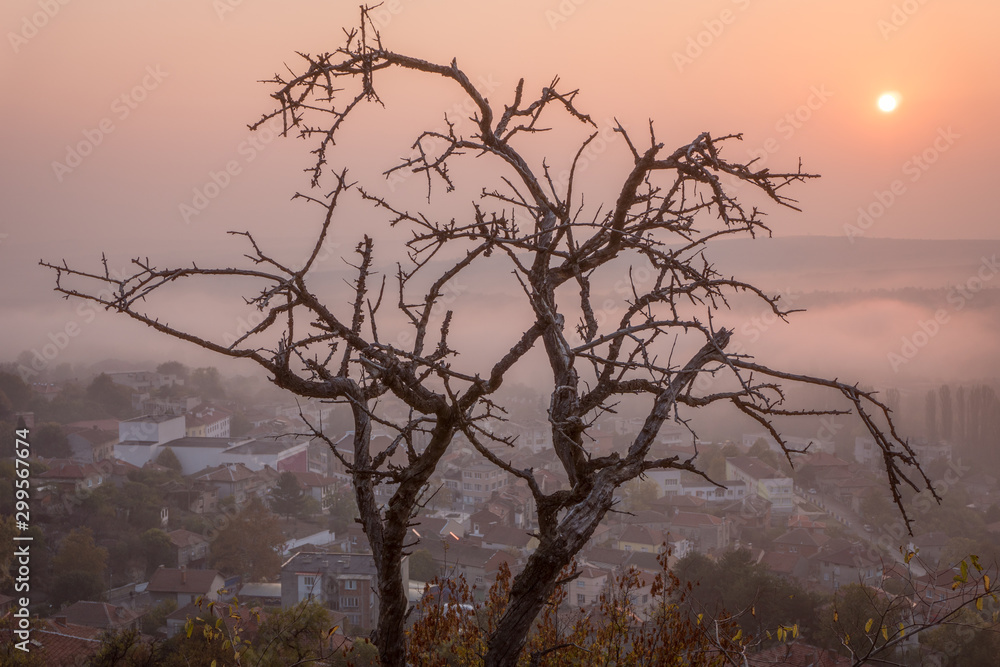 Mystic sunrise over small Bulgarian town - beautiful light through morning mist Mystic sunrise over small Bulgarian town - beautiful light through morning mist