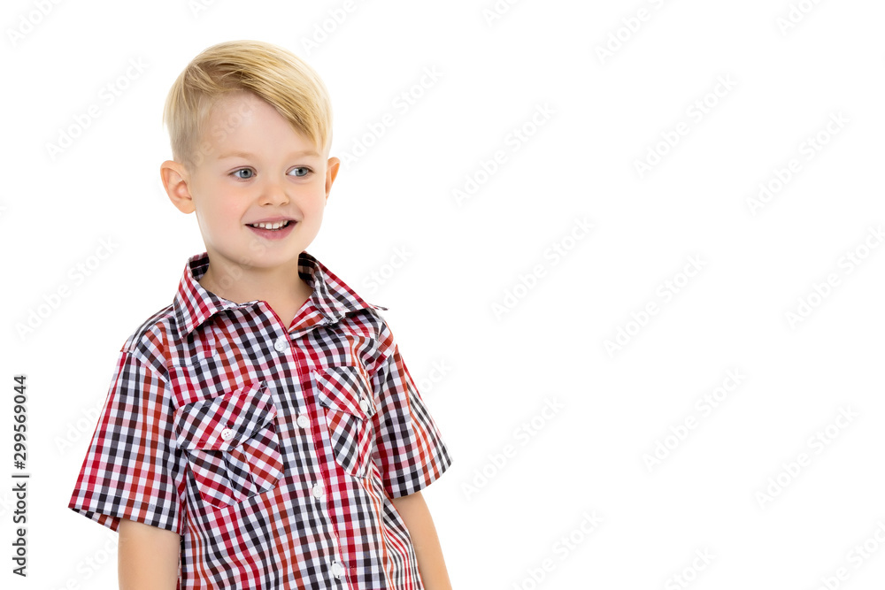 A cute little boy in a shirt and shorts. A cute little boy in a shirt and shorts.