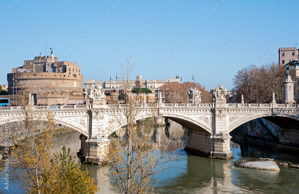 Ponte Sant'Angelo with the Castel Sant'Angelo in the background, Rome, Italy. Buildings completed in 134 AD by Roman Emperor Hadrian to span the Tiber, from the city center to his mausoleum.