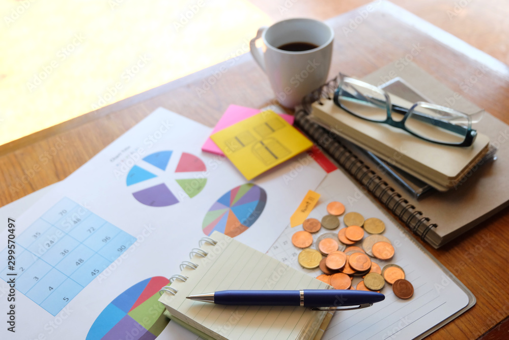 graph paper and coin with business concept graph paper and coin with business concept
