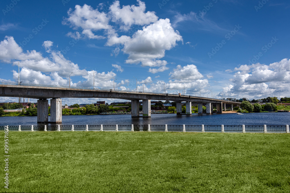 Russia, Golden Ring, Kostroma: Panorama with big bridge over Kostroma River near famous Ipatievsky Monastery near the city center of the Russian town with blue cloudy sky - traffic. Russia, Golden Ring, Kostroma: Panorama with big bridge over Kostroma River near famous Ipatievsky Monastery near the city center of the Russian town with blue cloudy sky - traffic.