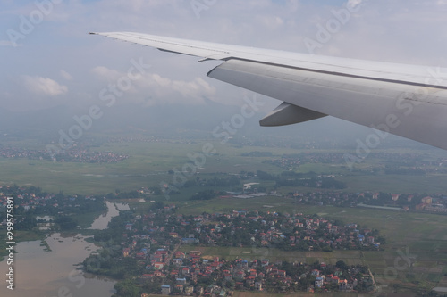 Wing aircraft  sky background and the city of Hanoi Vietnam