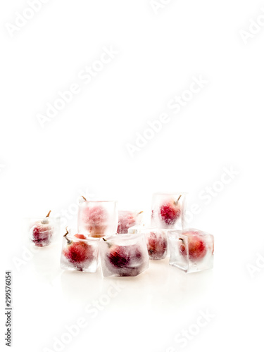 Grape inside ice on white background