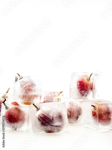 Grape inside ice on white background