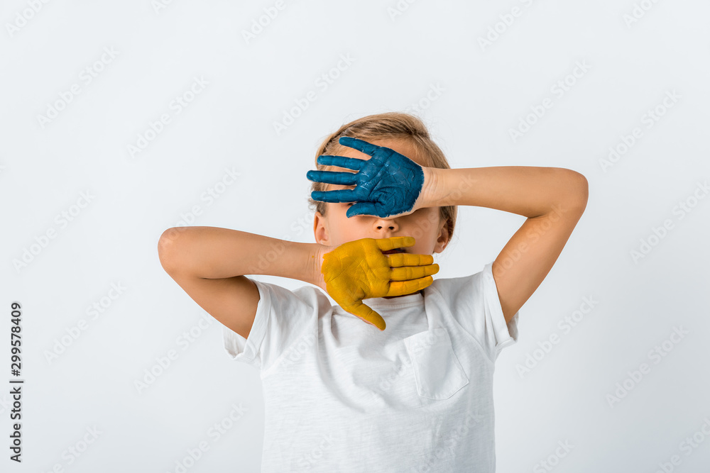 kid with paint on hands covering face isolated on white kid with paint on hands covering face isolated on white
