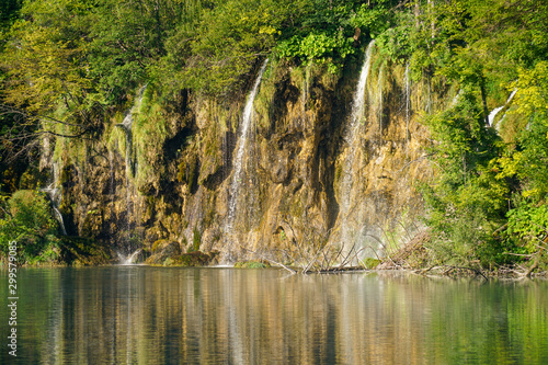 View from the ship to the shores and waterfalls of Plitvice Lakes National Park