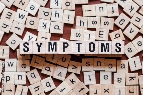 Symptoms word concept on cubes for articles