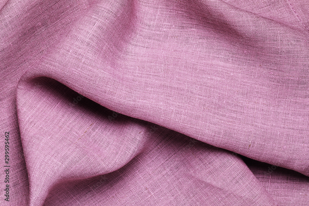 Fototapeta premium Background from a purple tablecloth, top view