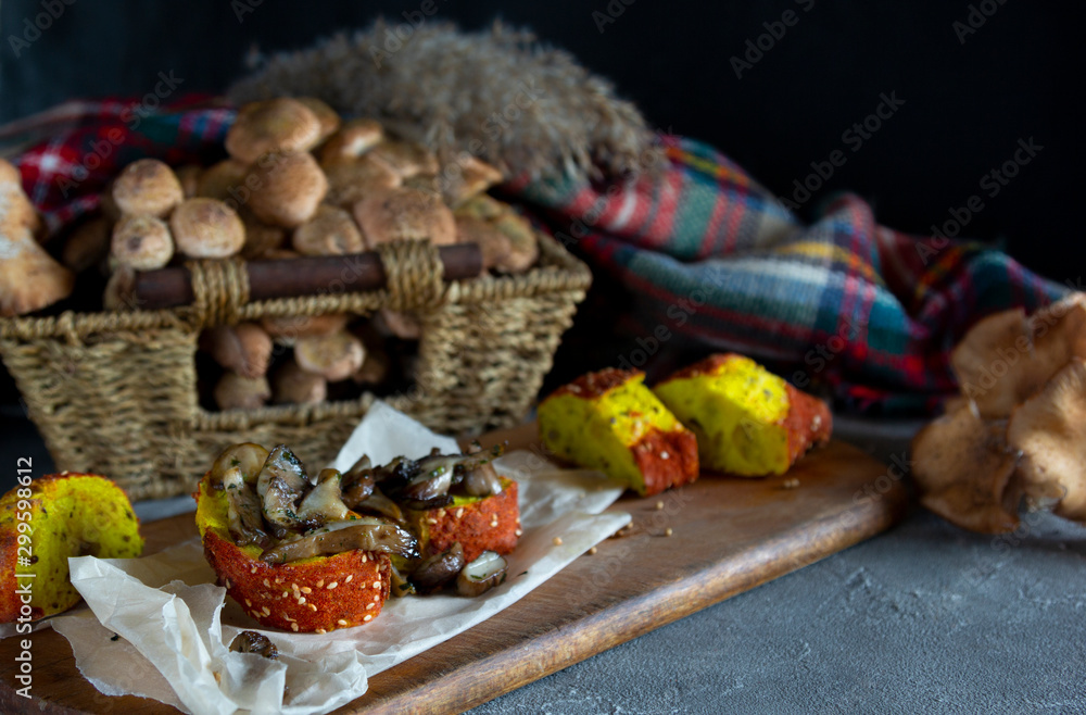 Autumn Forest fried mushrooms on bread. Honey agarics on a table. Horizontal