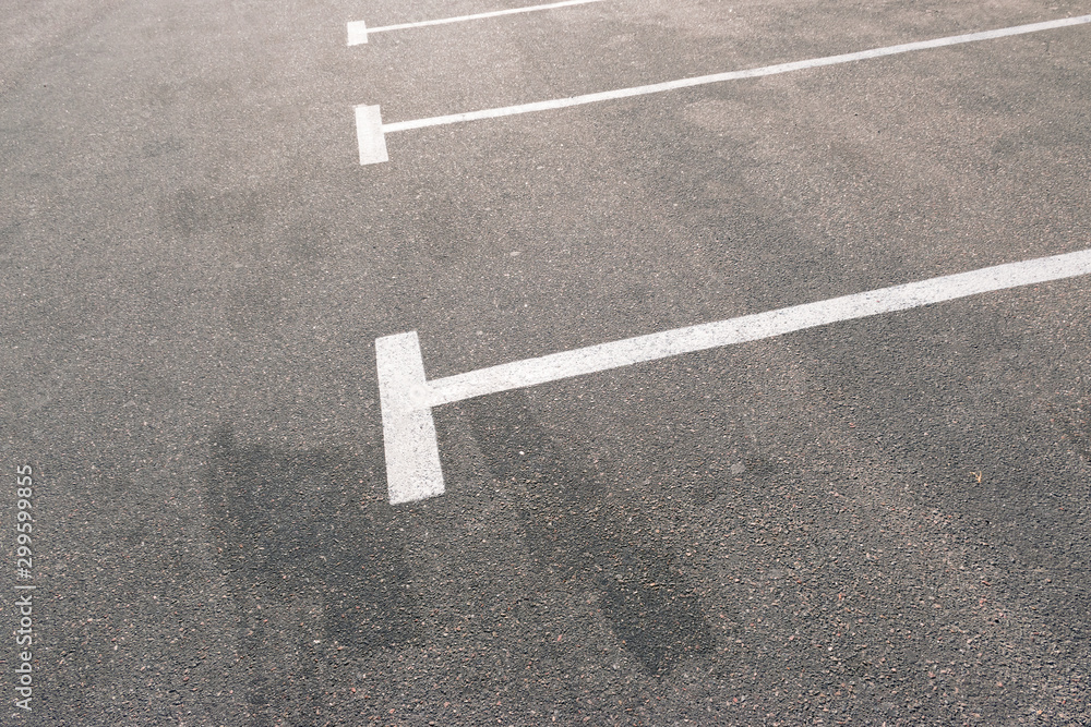 Road marking on asphalt with parking spots
