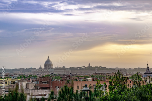 Skyline of the city of Rome at sunset. Sky with clouds and orange tones.