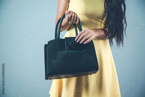 woman hand phone with bag in studio photo