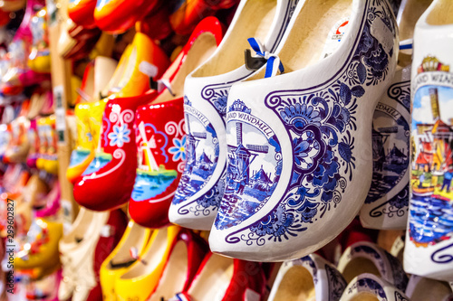 Obraz na plátně Rack in the store with rows traditional dutch wooden shoes - klompen (clogs), cl