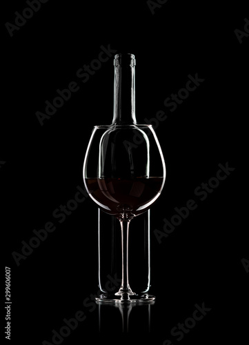 bottle and wine glass with red wine