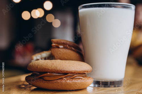 Close up Traditional chocolate and Pumpkin Whoopie pies made with vanilla cream cheese. Background for bakeries, cafes, restaurants photo