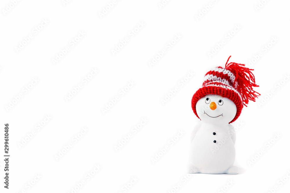 Happy snowman standing isolated on white background. Merry christmas and happy new year greeting card. Funny snowman in hat on snowy background. Copy space for text - obrazy, fototapety, plakaty 