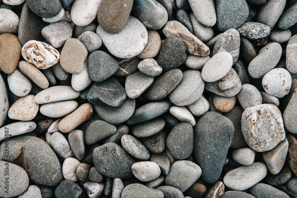 Gravel pattern of colored stones. Abstract nature pebbles background. Stone background. Sea peblles beach. Top view. Gravel pattern of colored stones. Abstract nature pebbles background. Stone background. Sea peblles beach. Top view.